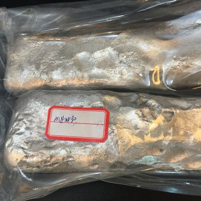 MgZr25 Magnesio Zirconio Master alloy con 25% di contenuto di zirconio per la raffinazione dei cereali in 5 kg di waffle ingot